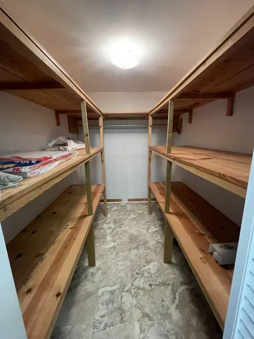 a storage room with washer and dryer