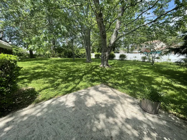 a view of outdoor space with deck and yard