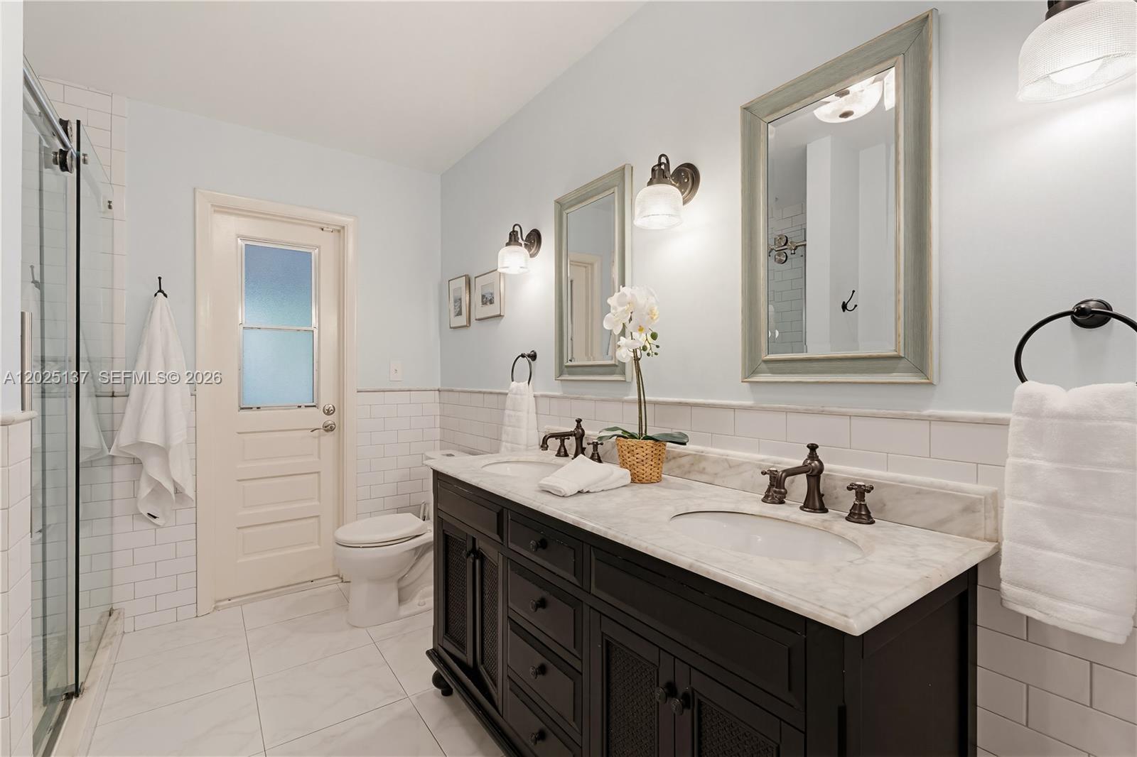11480 Southwest 96th Terrace Miami, FL 33176 - Photo 22 of 54 a bathroom with a sink vanity granite and a mirror