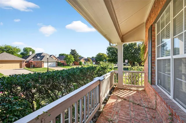 a view of balcony and yard