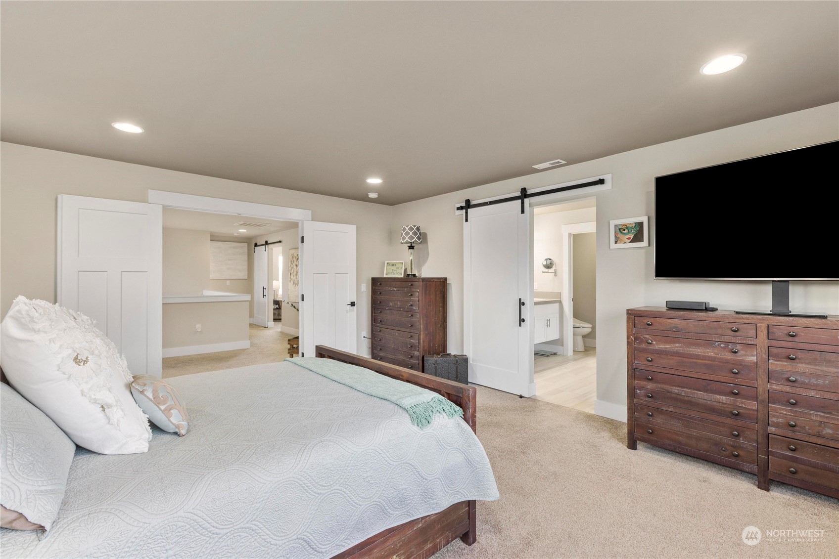 111 Love Drive Enumclaw, WA 98022 - Photo 18 of 34 a bedroom with a bed and flat screen tv