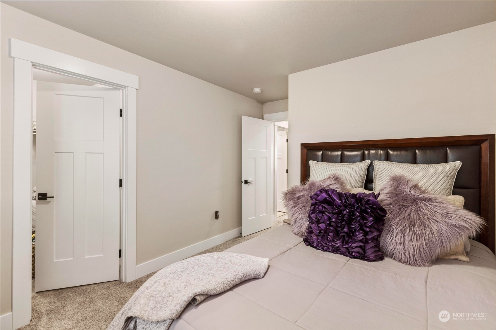 111 Love Drive Enumclaw, WA 98022 - Photo 23 of 34 a bedroom with a bed and a walk in closet