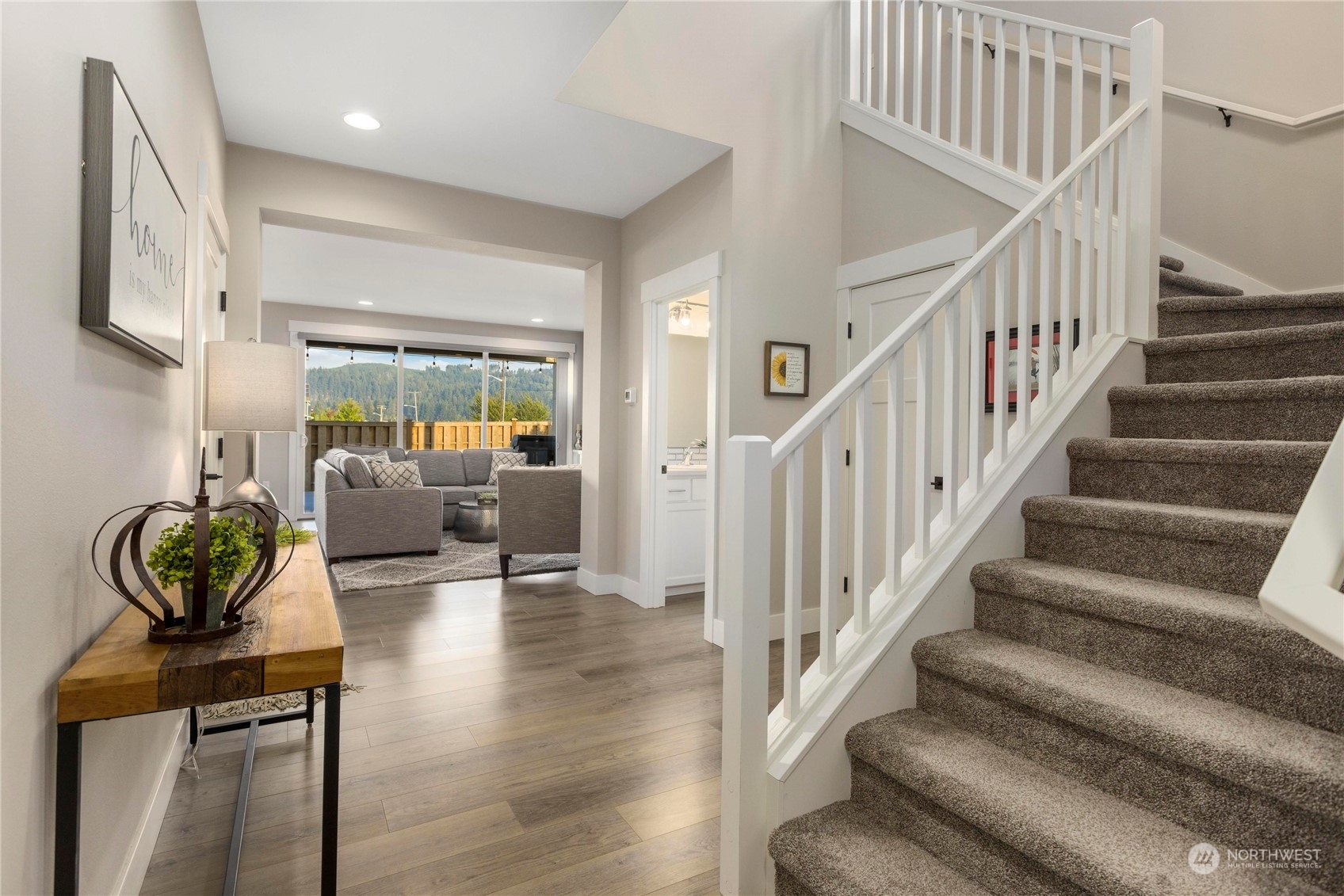 111 Love Drive Enumclaw, WA 98022 - Photo 3 of 34 a living room with furniture and a chandelier