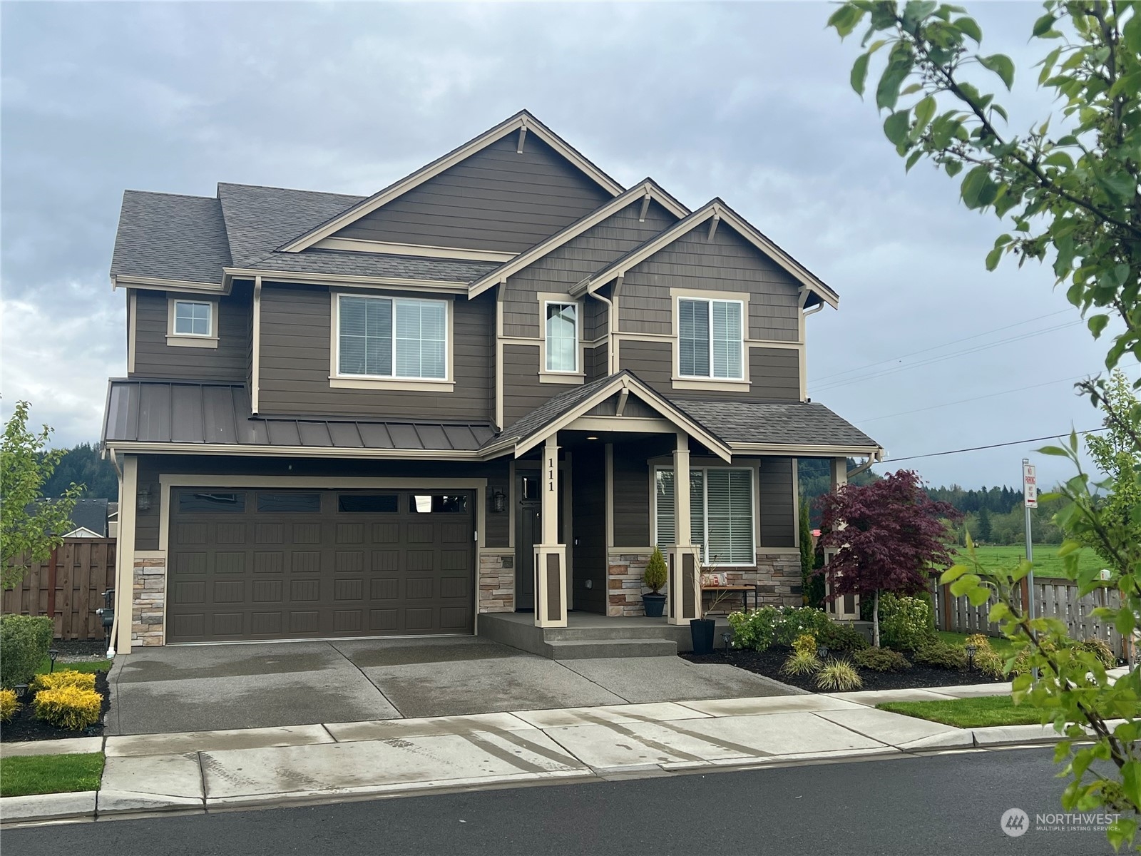 111 Love Drive Enumclaw, WA 98022 - Photo 31 of 34 a front view of a house with garden
