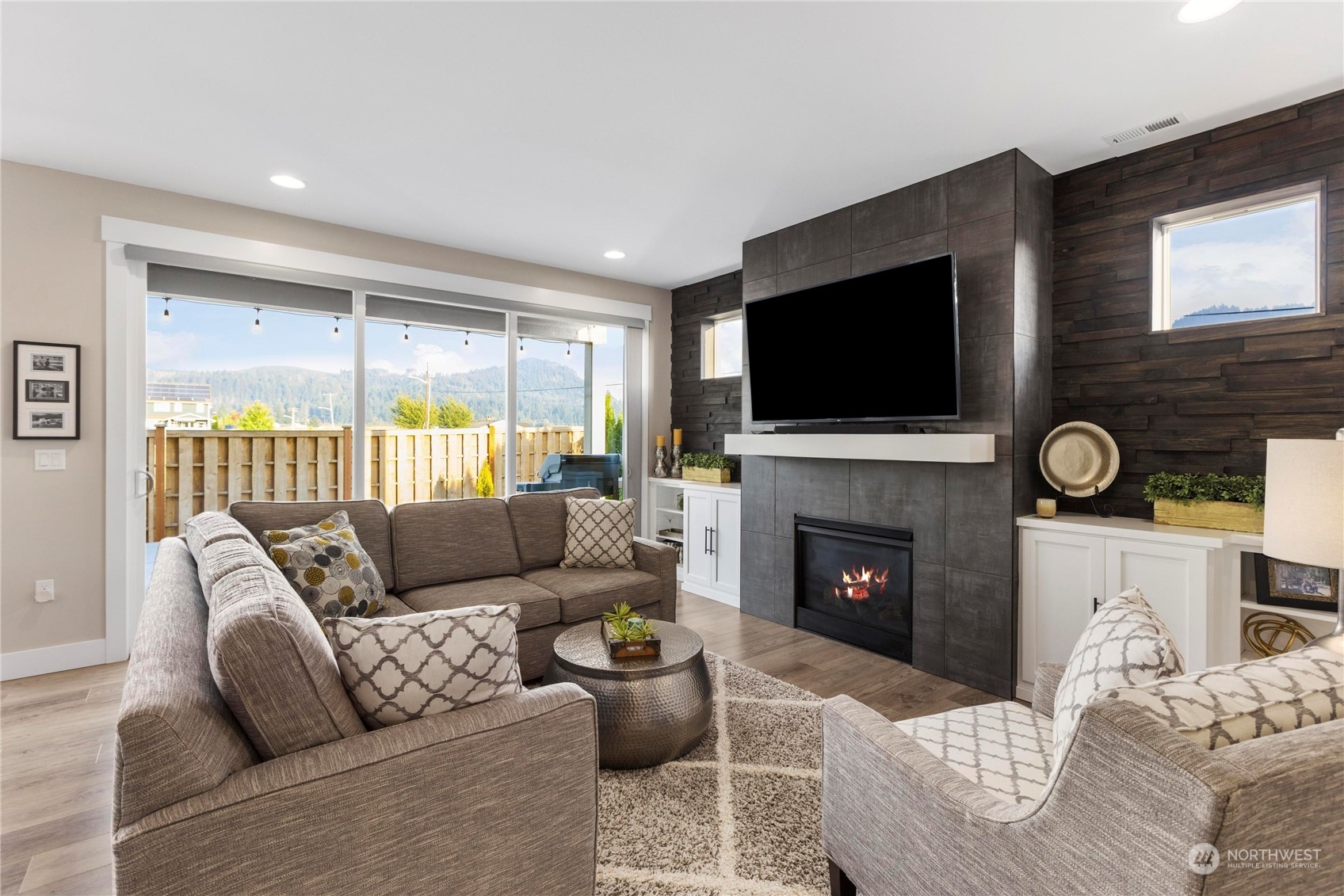 111 Love Drive Enumclaw, WA 98022 - Photo 4 of 34 a living room with furniture a fireplace and a flat screen tv