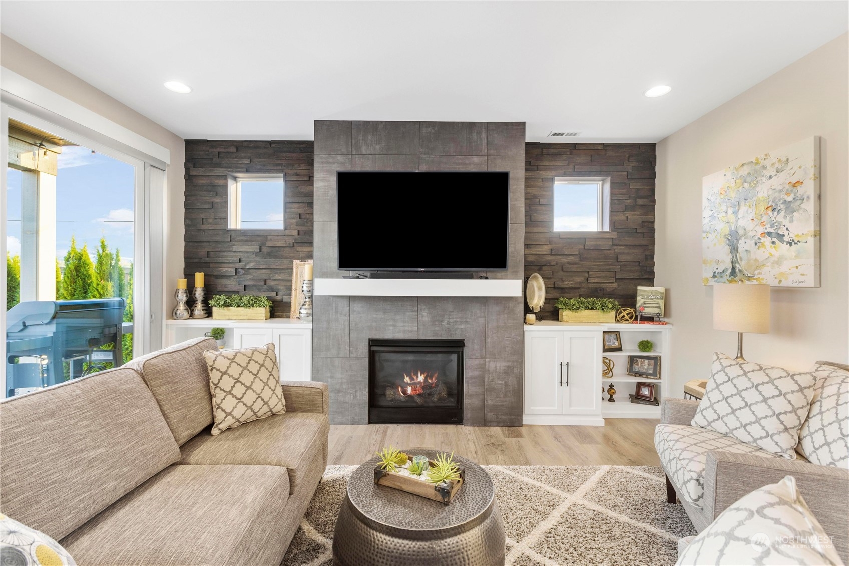111 Love Drive Enumclaw, WA 98022 - Photo 5 of 34 a living room with furniture a flat screen tv and a fireplace