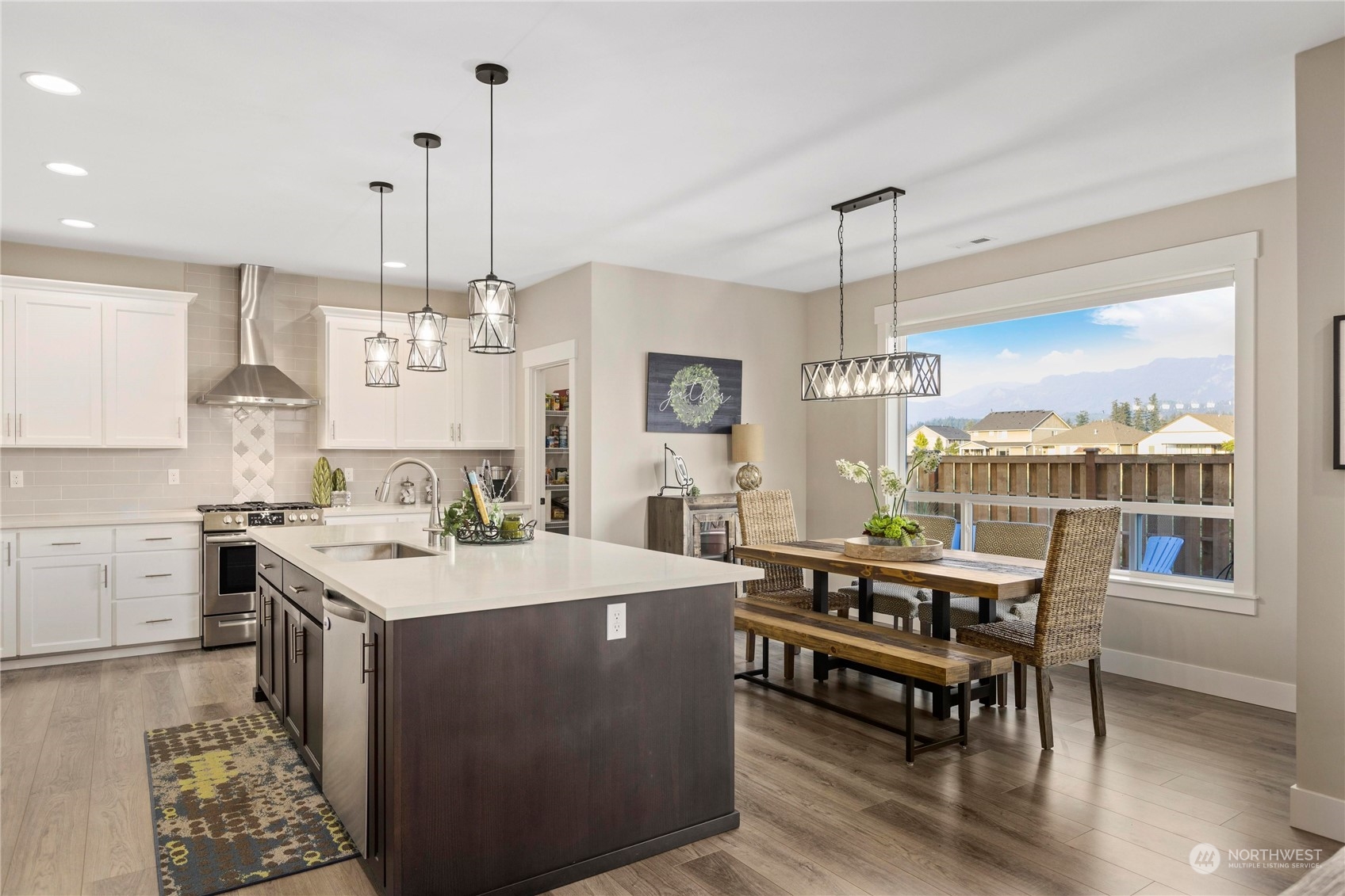 111 Love Drive Enumclaw, WA 98022 - Photo 8 of 34 a large kitchen with kitchen island a large island in it