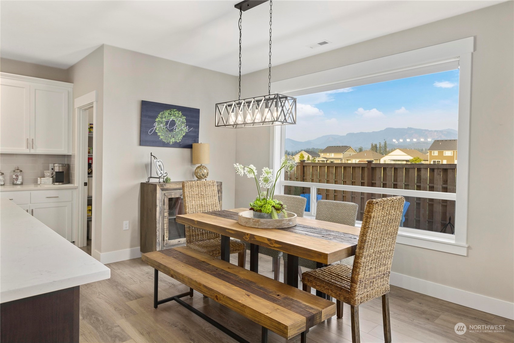 111 Love Drive Enumclaw, WA 98022 - Photo 9 of 34 a dining room with furniture a chandelier and wooden floor
