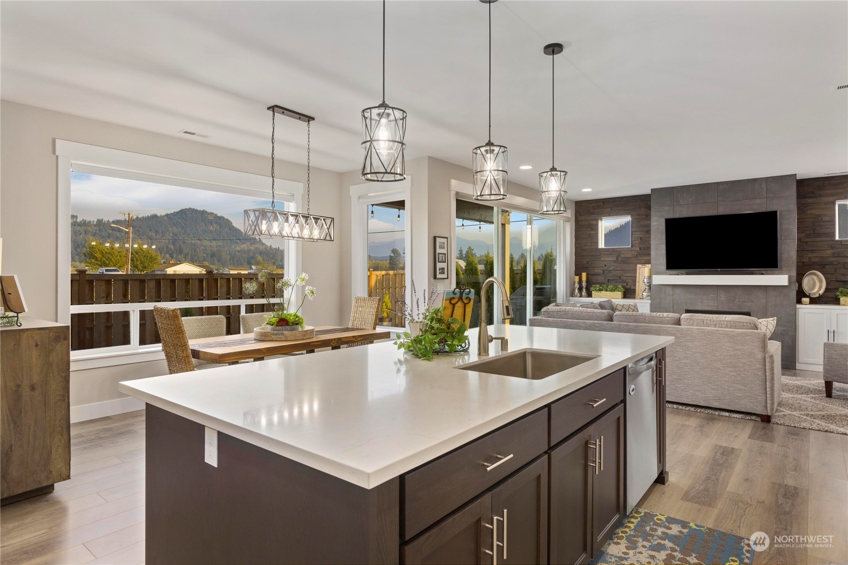 111 Love Drive Enumclaw, WA 98022 - Photo 10 of 34 a kitchen with stainless steel appliances a sink a counter top space and a view of living room