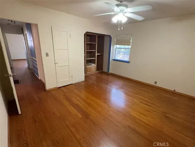 a bathroom with a tub shower sink and mirror