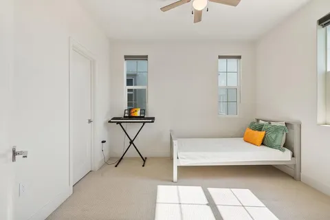 a bedroom with furniture and a window