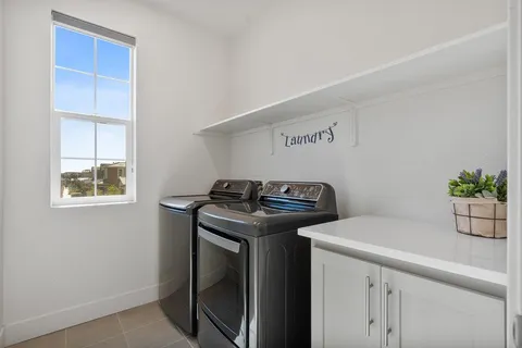 a view of storage and utility room with washer and dryer