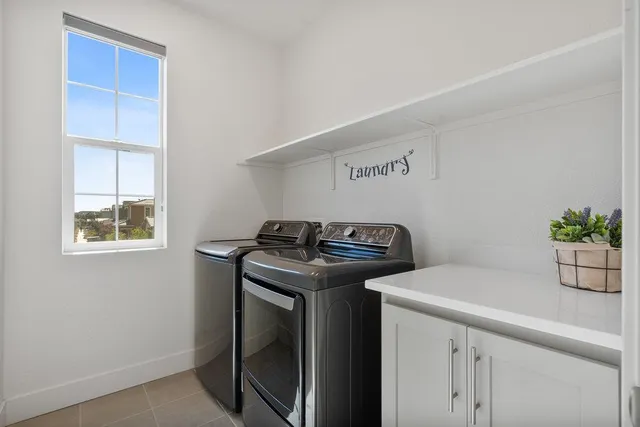 a view of storage and utility room with washer and dryer