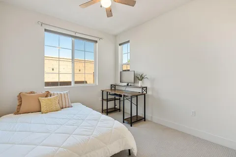 a bedroom with a bed and a window