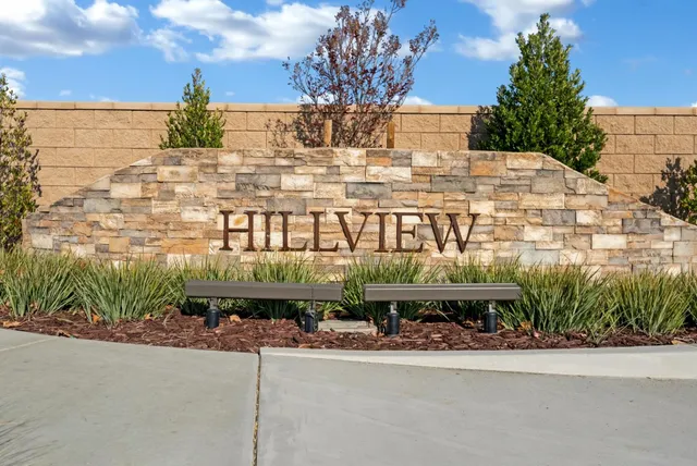 a front view of a building with garden