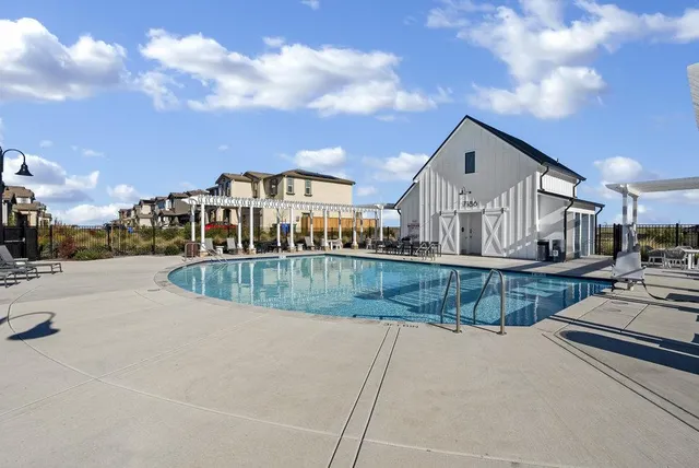 a view of multiple houses with a yard