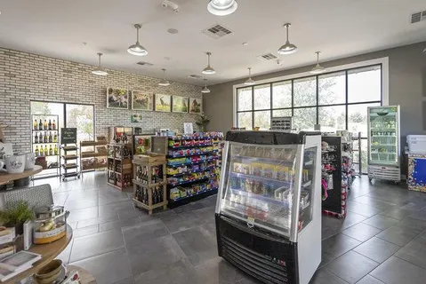 a room with lots of furniture and a large window