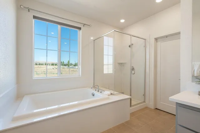 a bathroom with a bathtub and a shower