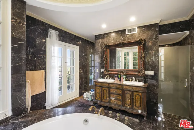 a bathroom with a sink mirror vanity and toilet