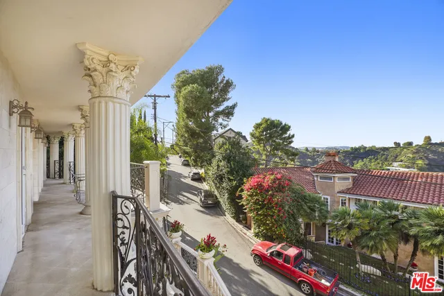 a view of a house with a flower garden