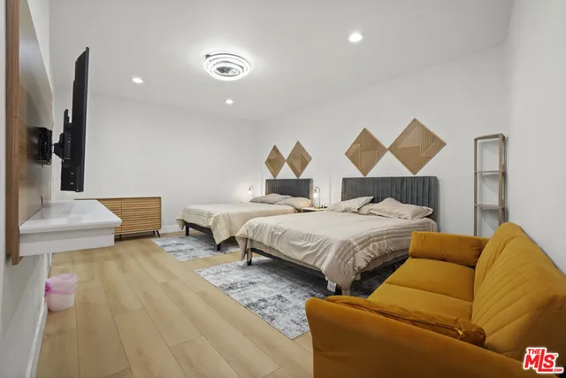 a bedroom with a bed and a lamp