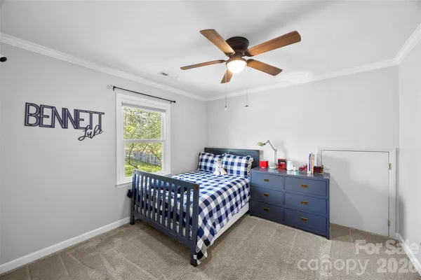 a bed room with a bed and a window