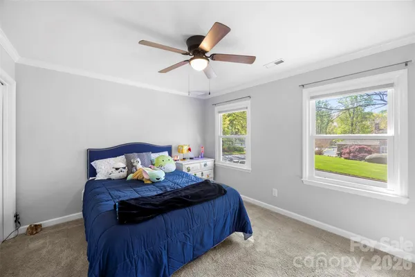 a bed room with furniture and a window