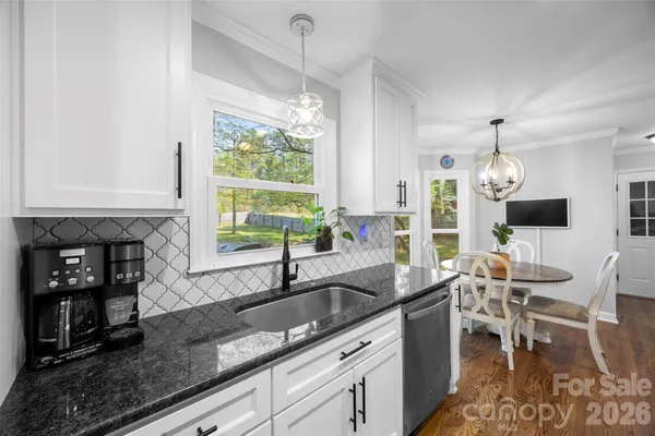 a kitchen with a sink and counter top space
