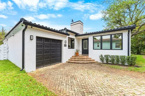 a front view of a house with a garage