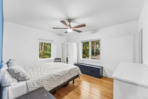 a bedroom with a large bed and a window