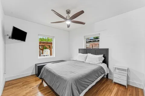 a bedroom with a bed and a window