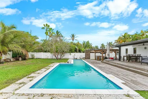 a view of a swimming pool with a patio