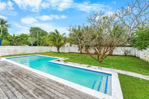 a view of swimming pool with a yard