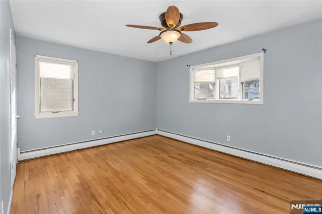 a view of room with window and ceiling fan