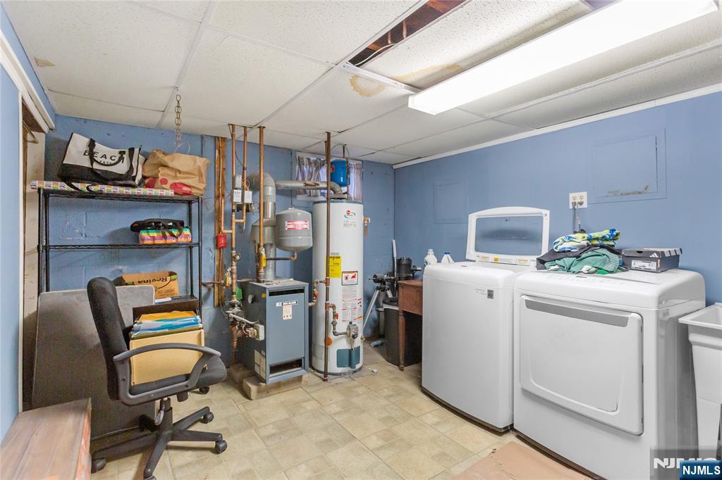 86 Reservoir Avenue Butler, NJ 07405 - Photo 25 of 32 a view of a storage & utility room with washer and dryer