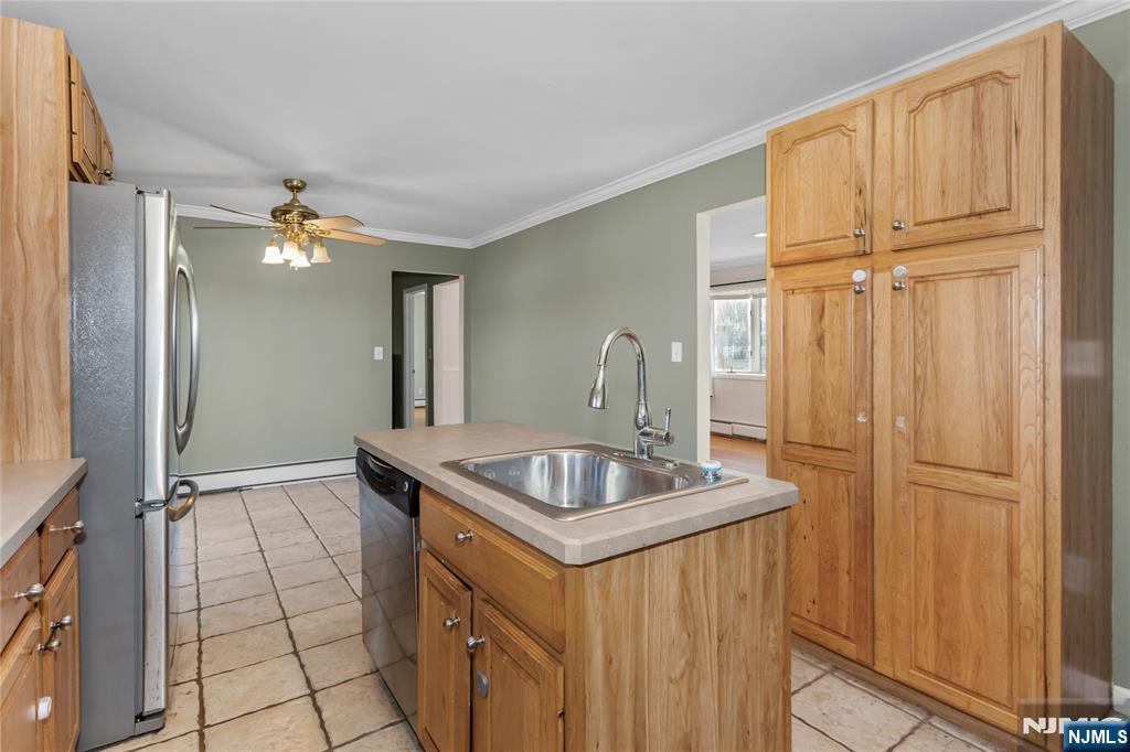 86 Reservoir Avenue Butler, NJ 07405 - Photo 7 of 32 a bathroom with a sink a vanity and a mirror
