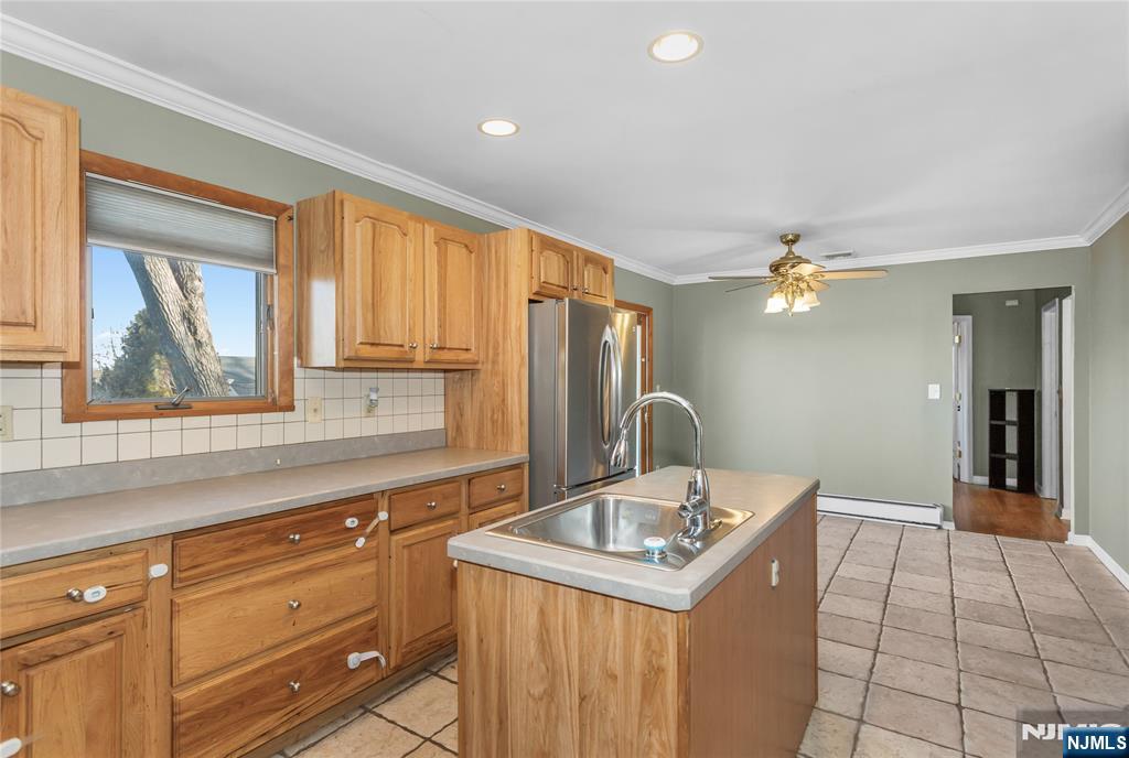 86 Reservoir Avenue Butler, NJ 07405 - Photo 10 of 32 a kitchen with a sink cabinets and window