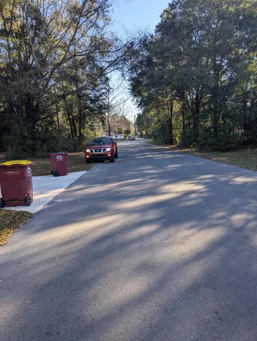 a view of street with parked cars