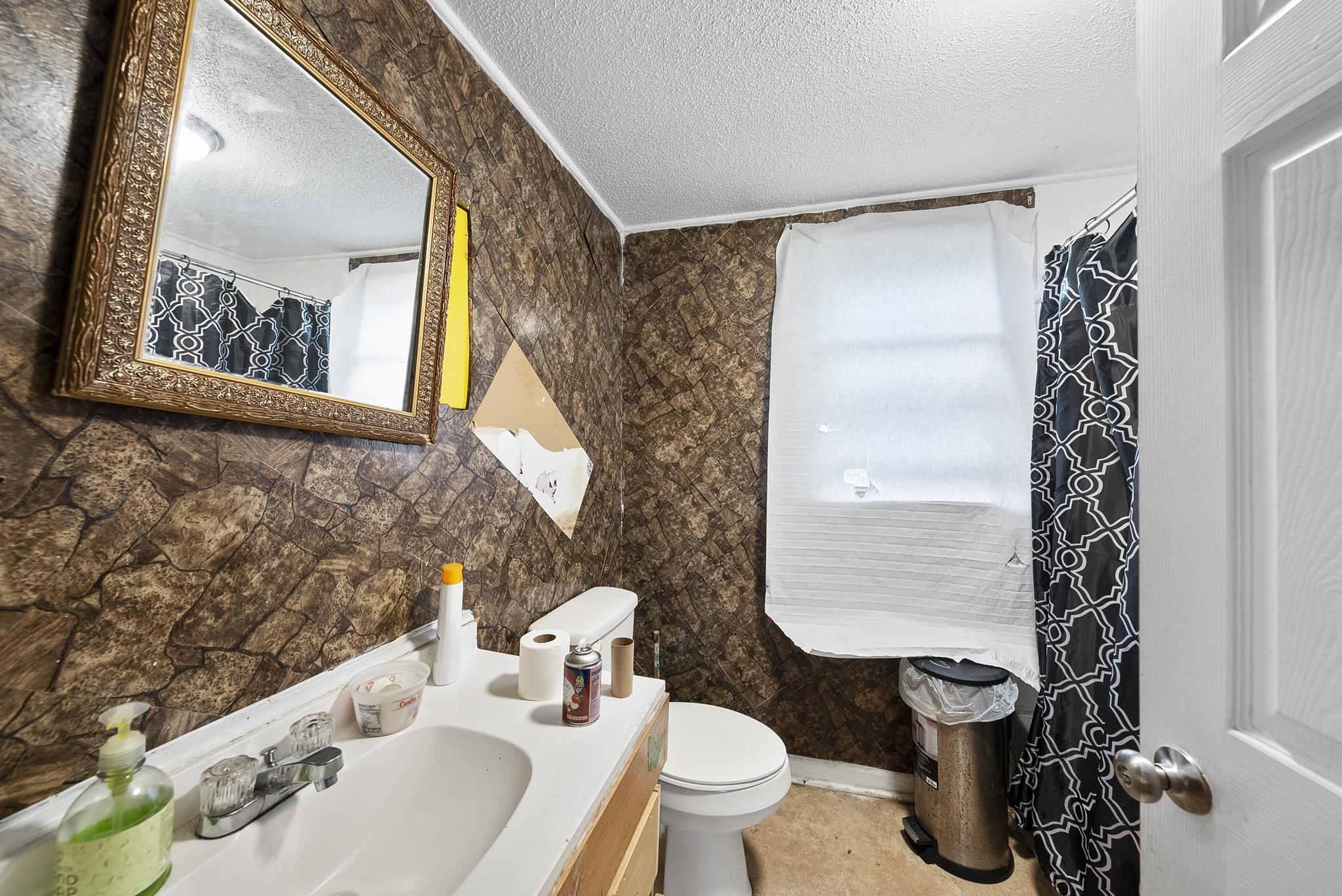 104 Short Street Dunn, NC 28334 - Photo 12 of 14 a bathroom with a sink toilet and shower