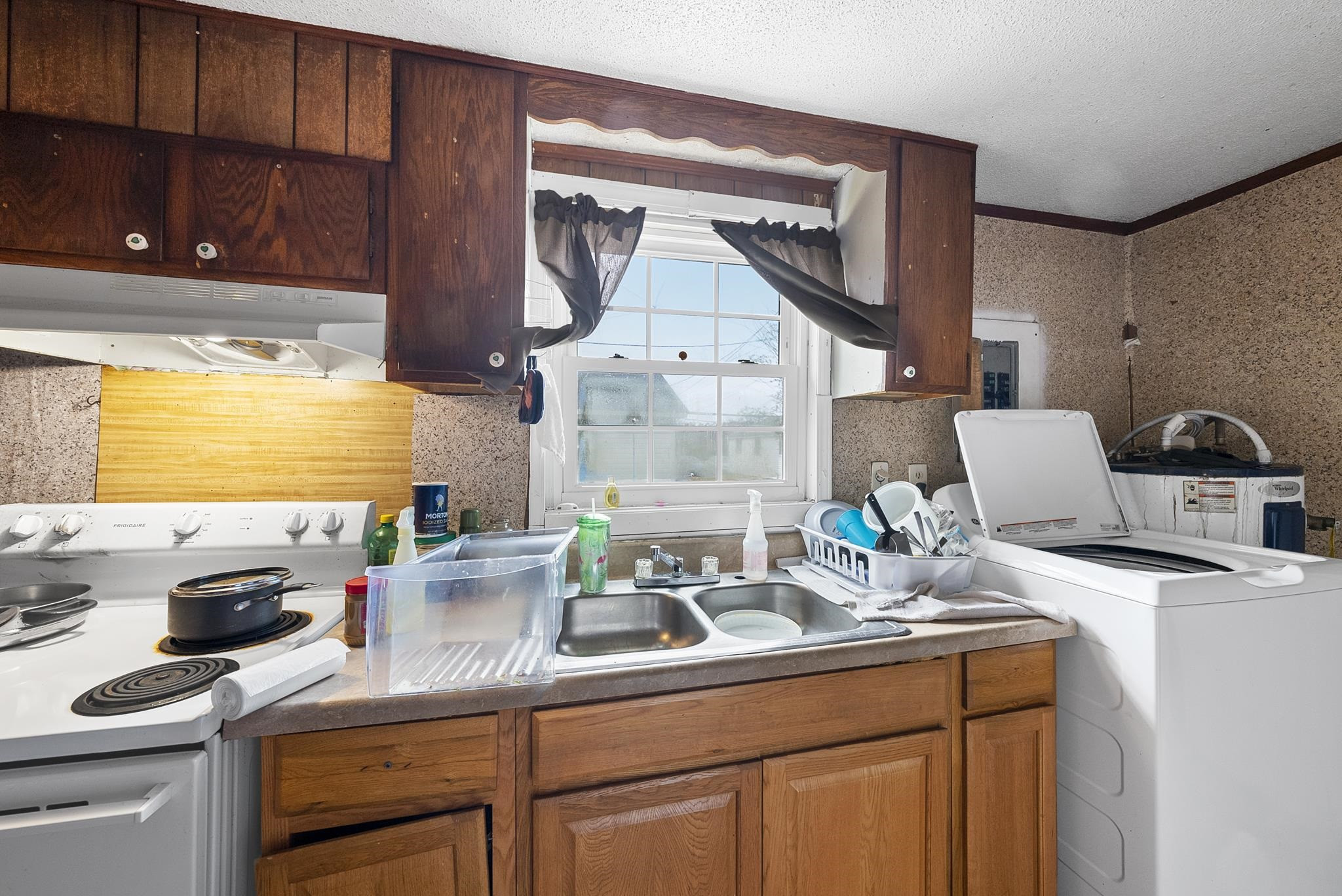 104 Short Street Dunn, NC 28334 - Photo 5 of 14 a kitchen with a sink cabinets and window