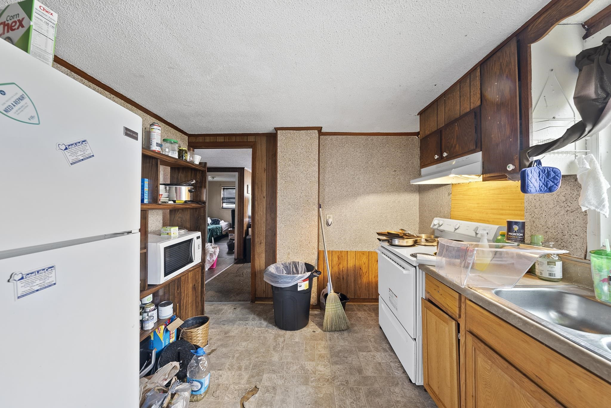 104 Short Street Dunn, NC 28334 - Photo 6 of 14 a kitchen with a sink stove and cabinets