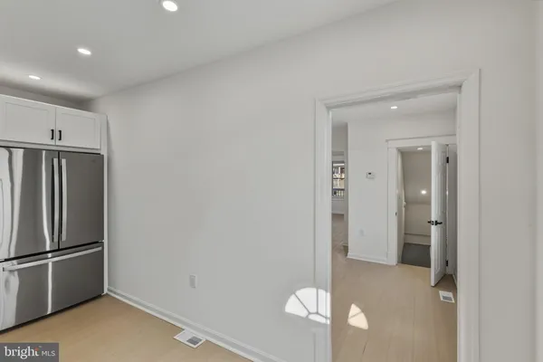 a view of a kitchen with a refrigerator
