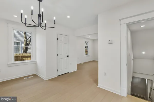 a view of empty room and wooden floor