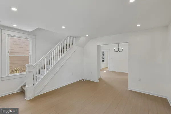 a view of an empty room with stairs