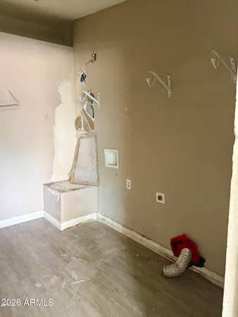a living room with table flowerpot and window