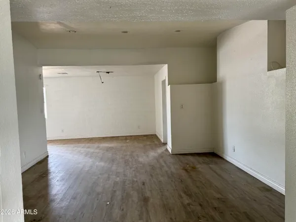an empty room with wooden floor
