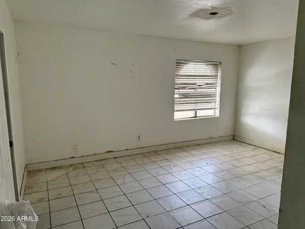 a view of an empty room and window