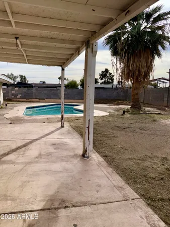a view of a swimming pool with yard