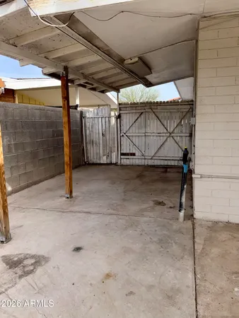a view of a swimming pool with a table and chair