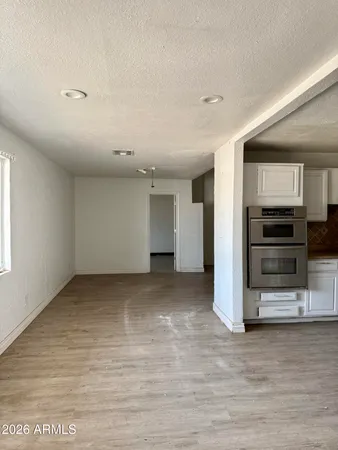 a view of a kitchen with refrigerator and stove